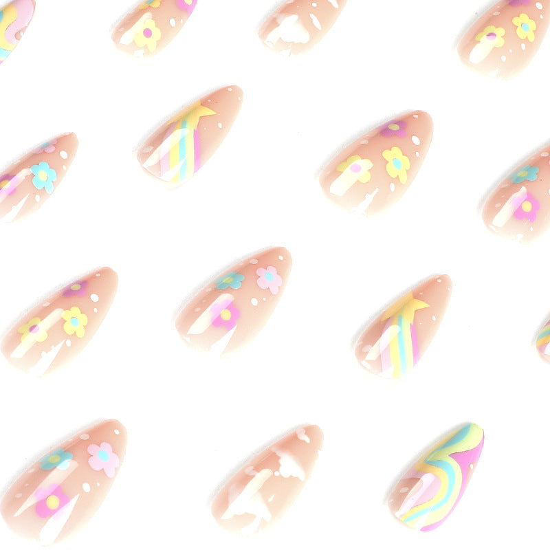 Artful nail art with cheerful designs and colorful accents Kalsten