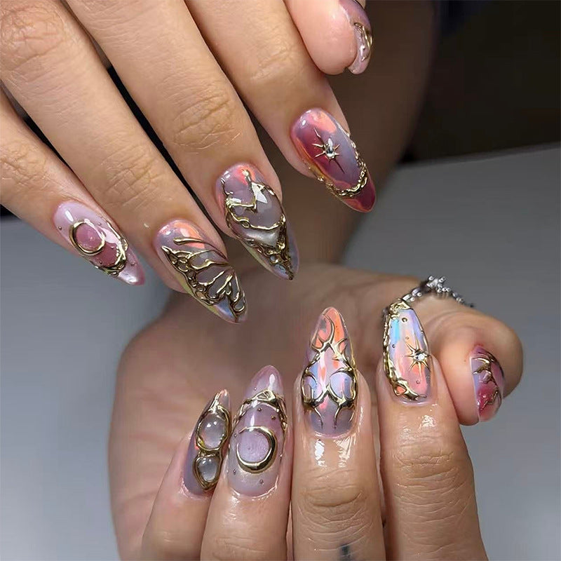 Acrylic nail set with glamorous 3D designs and elegant gold accents Kalsten