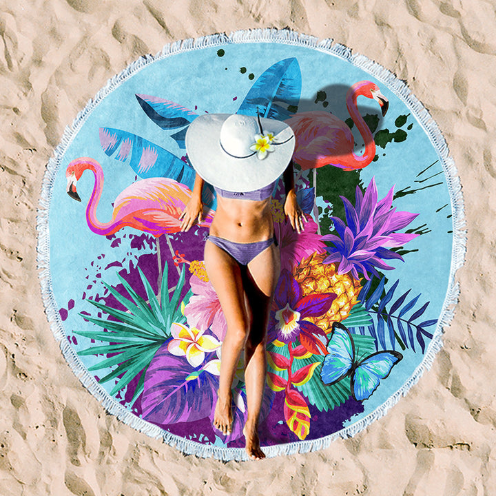 Round beach towel with colorful, tropical floral pattern and fringe decoration Kalsten