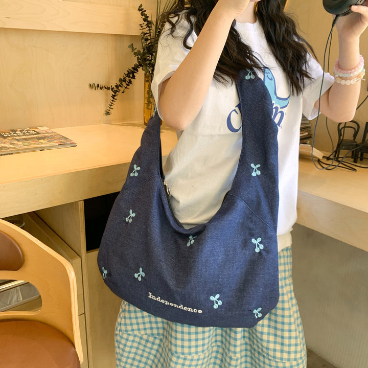 Comfortable shoulder bag with original embroidery motif Kalsten