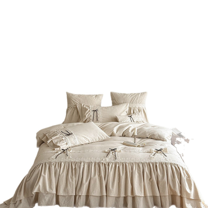 Ruffled bedding set with lace borders and decorative ribbons