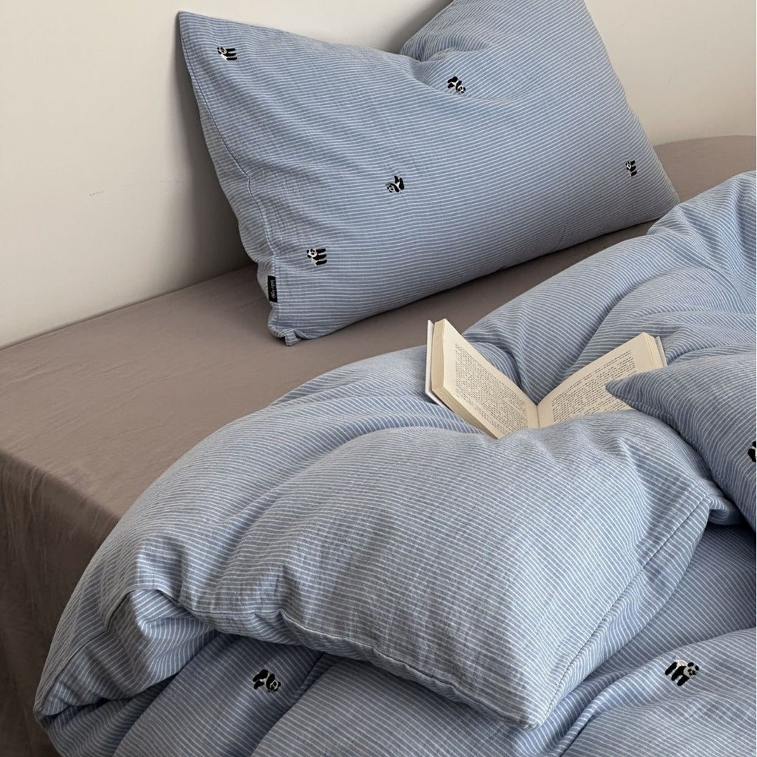 Cotton duvet cover set with fine pinstripes and subtle embroidery applications