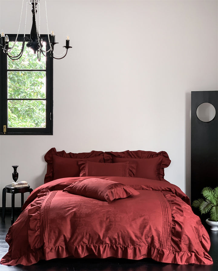 Elegant satin bedding set with ruffles, fine piping and jacquard relief