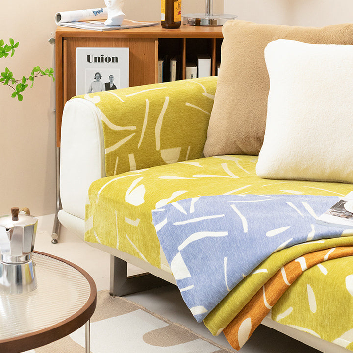 Removable sofa cover with abstract graphic print and elastic fitting edge