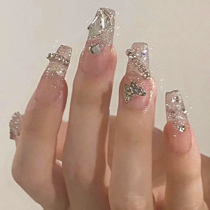 Glamorous artificial nails with sparkling rhinestones and elegant designs Kalsten