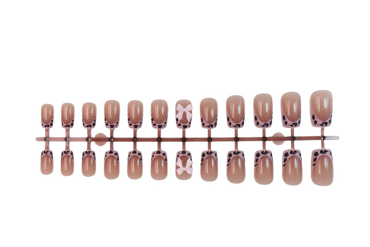 Acrylic nail set with playful bows and modern accents Kalsten