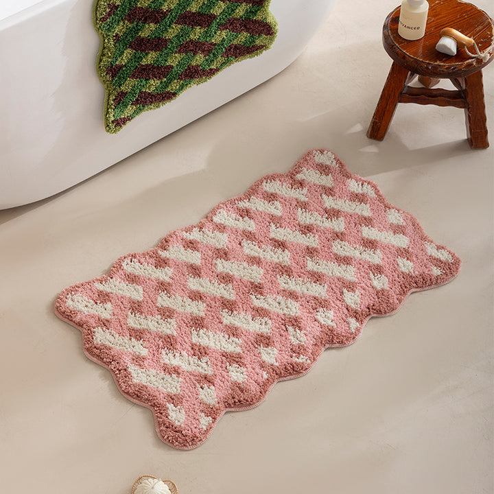 Tufted bathroom mat with wavy edge and geometric relief