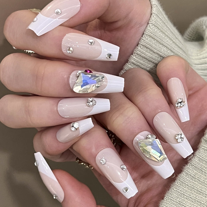 Artistic nail art with glitter accents and rhinestone embellishments Kalsten