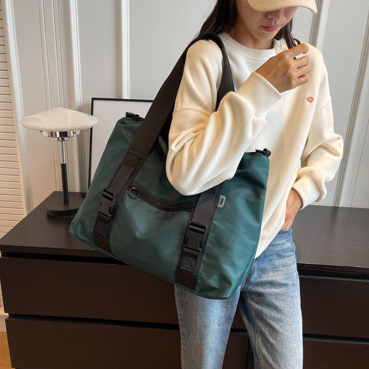 Spacious sports duffel bag with ergonomic carrying handles and water-repellent material Kalsten