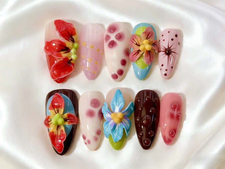 Artistic Press-On Nail Set with Floral and Green Accents