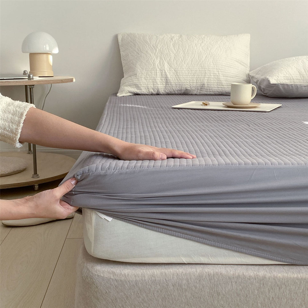 Quilted mattress topper fitted sheet with elastic all-around rubber