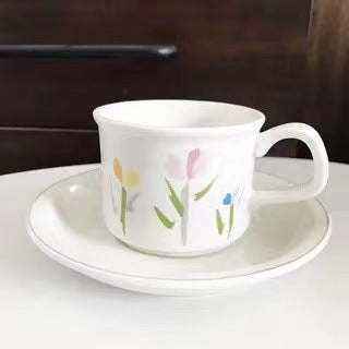 Fine porcelain tea cup with saucer and delicate floral motif