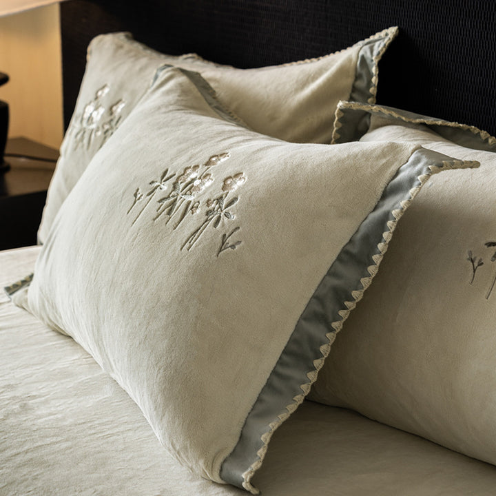 Premium cotton satin bed linen set with floral relief embroidery and satin trim