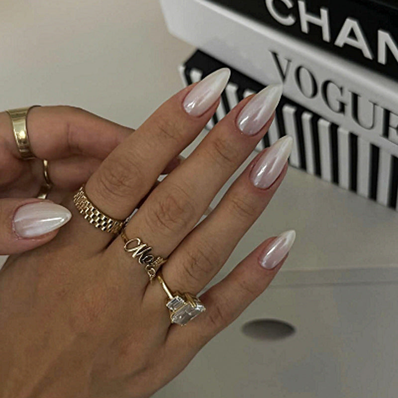 Acrylic nail set with elegant pointed shapes and glossy accents Kalsten