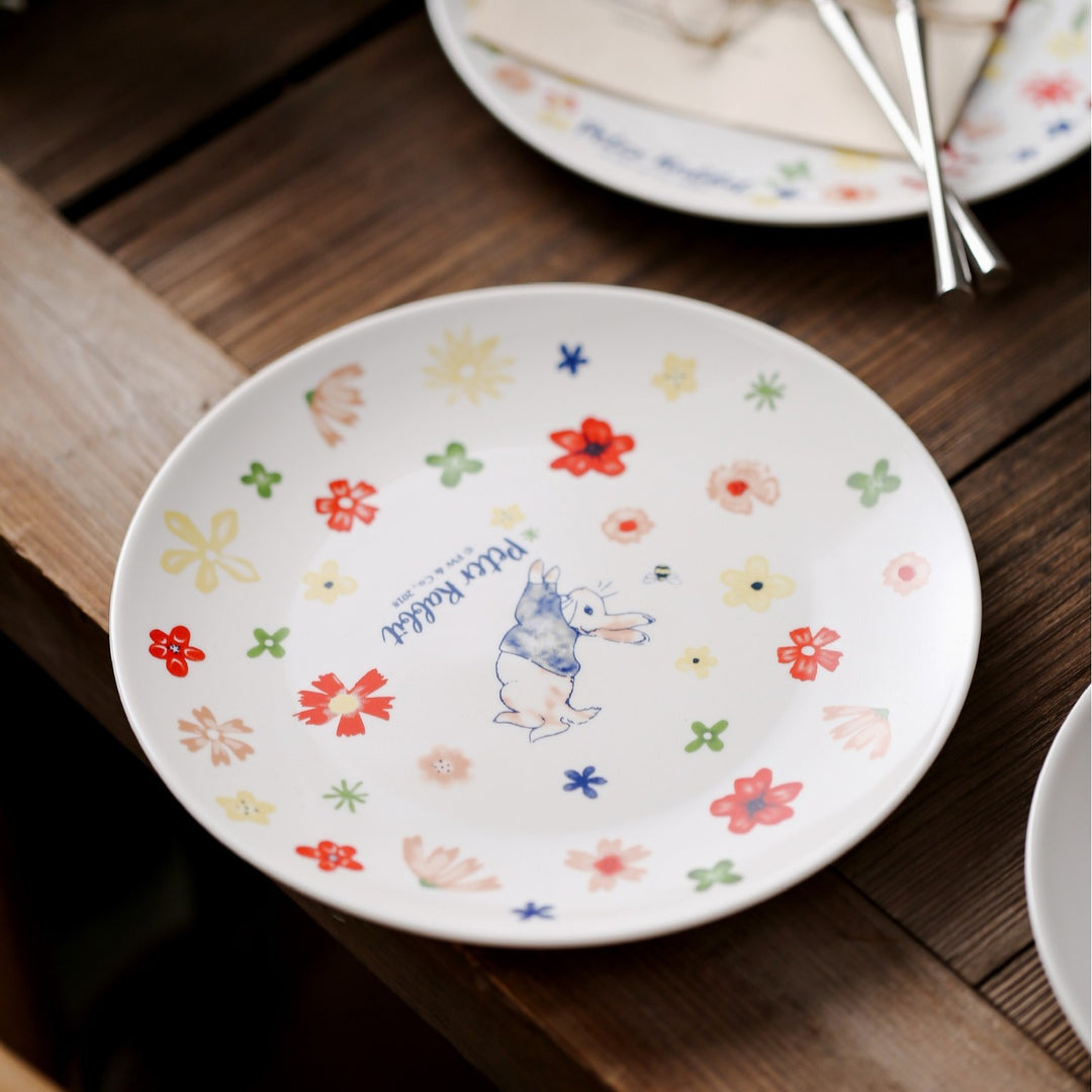 Children's plate made of porcelain with rabbit illustration and floral decoration