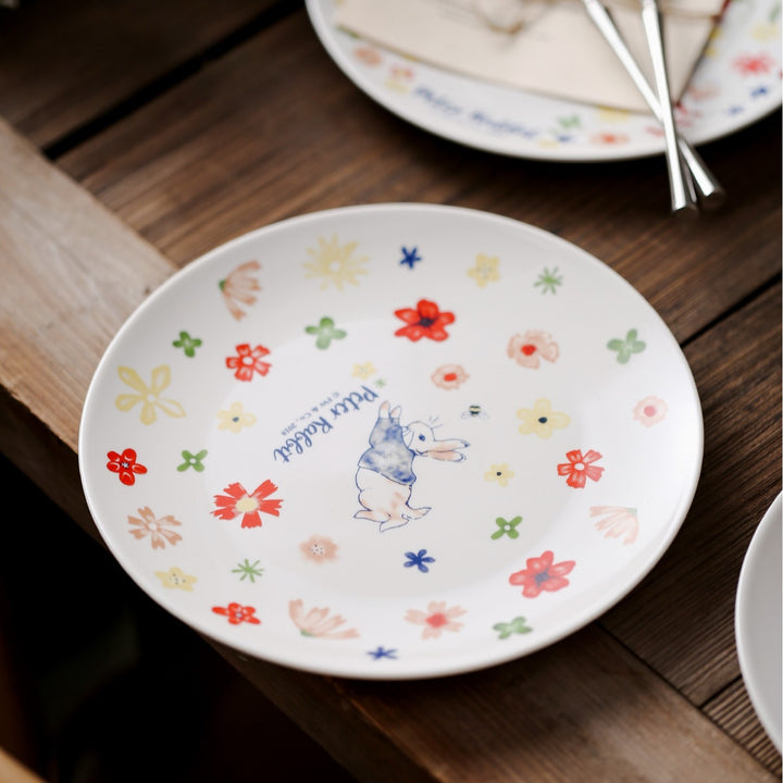 Children's plate made of porcelain with rabbit illustration and floral decoration