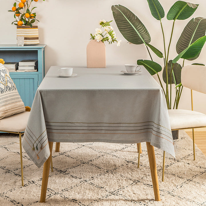 Rectangular tablecloth made of cotton-linen blend with fine embroidered stripe look and decorative tassels