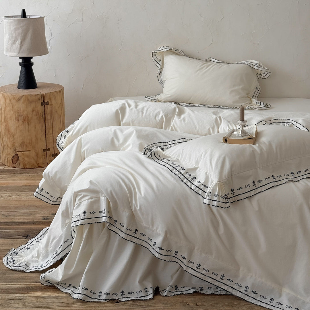 Luxurious embroidered bedding set with ruffled hem