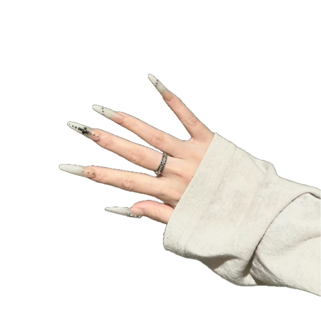 Artistic Stiletto Nail Art Extensions with Decorative Accents