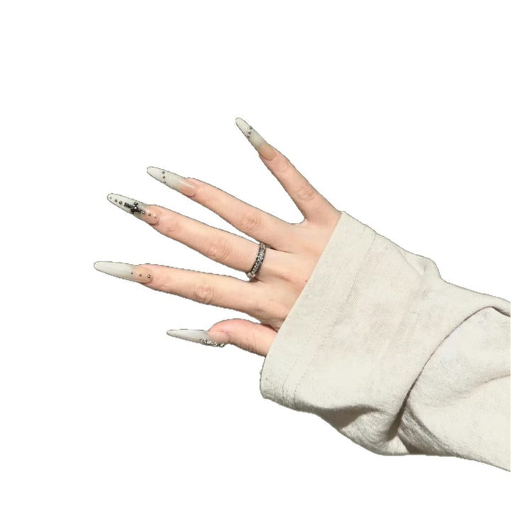 Artistic Stiletto Nail Art Extensions with Decorative Accents