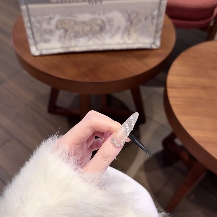 Artistic Long Stiletto Nail Extensions with Crystal Accents