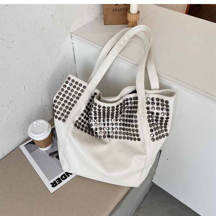 Fashionable shoulder bag with stylish rivet details Kalsten
