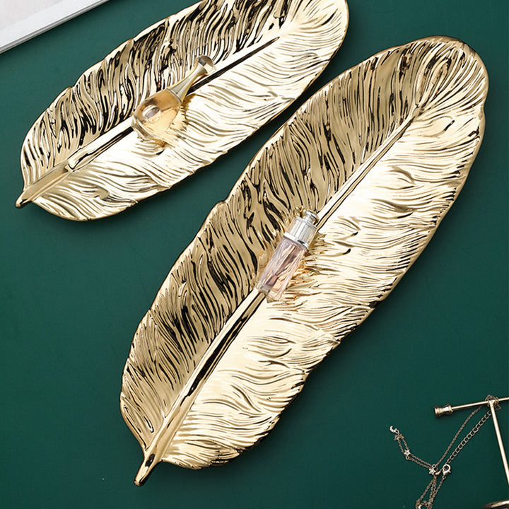 Leaf-shaped decorative tray made of metal with a textured surface