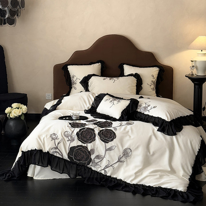 Luxurious bedding set with rose embroidery and ruffled hem