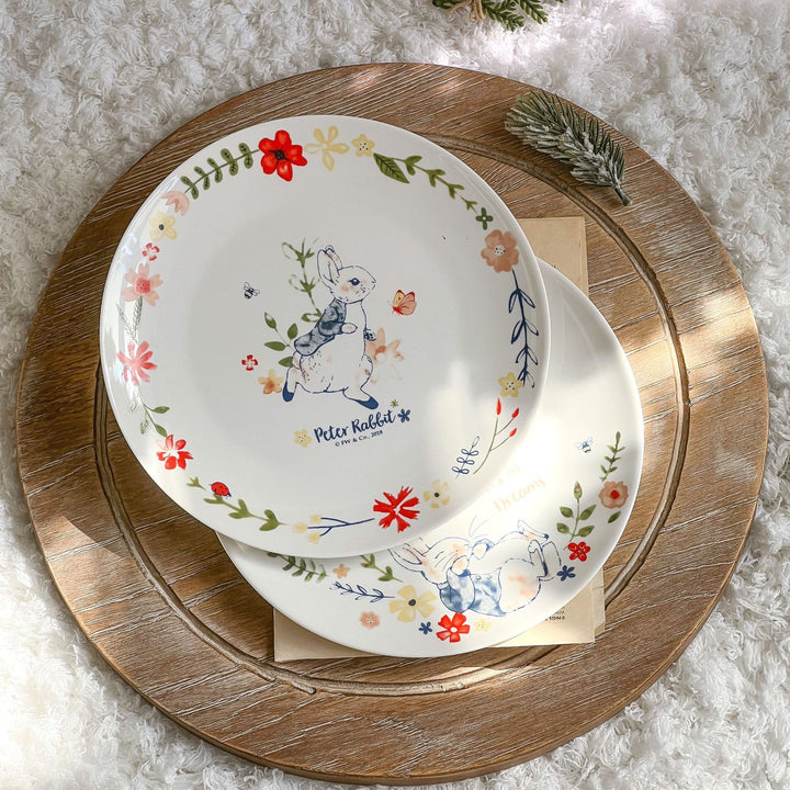 Children's plate made of porcelain with rabbit illustration and floral decoration