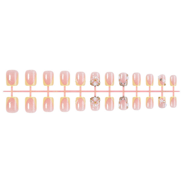 Artificial nail set with floral design and glamorous embellishments Kalsten