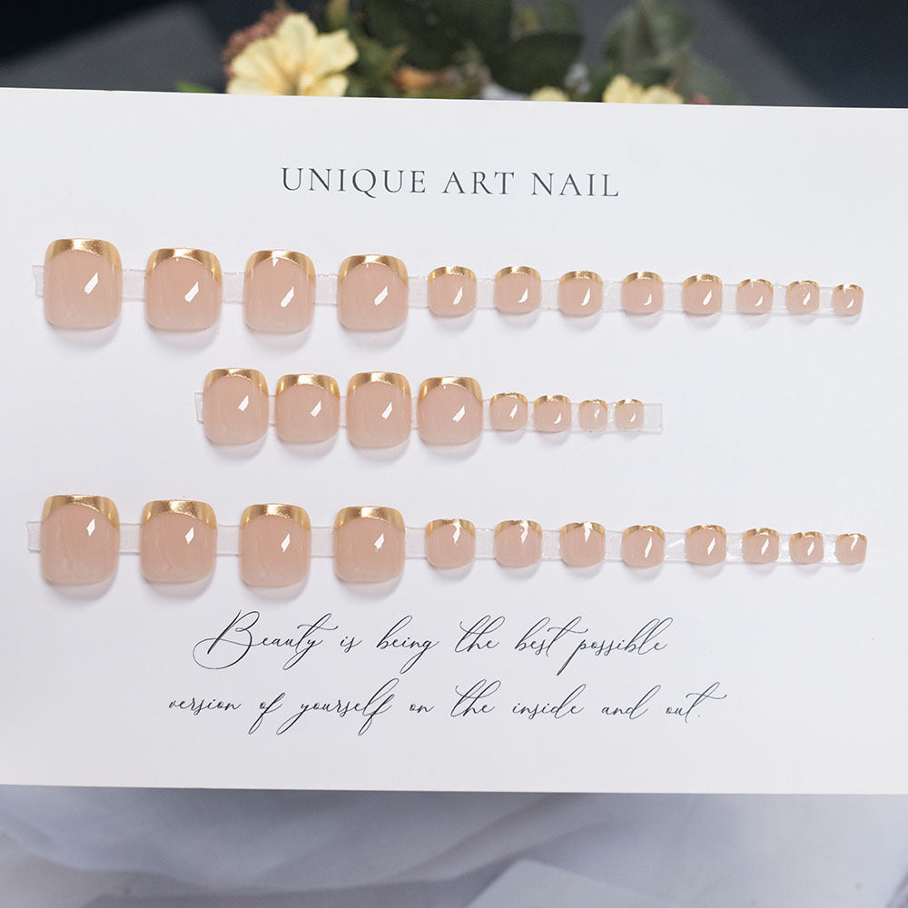 Press-On Nail Art with Elegant Gold Accents