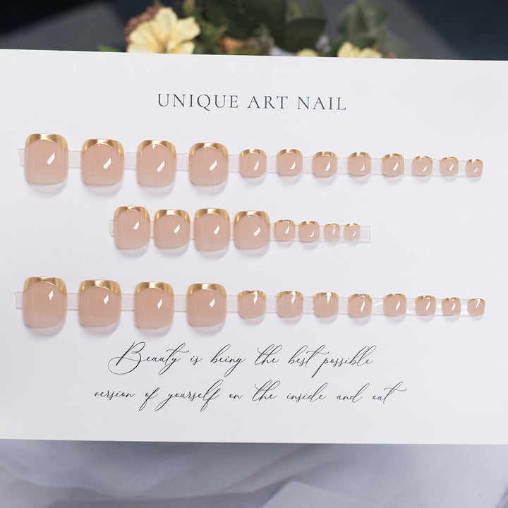 Press-On Nail Art with Elegant Gold Accents