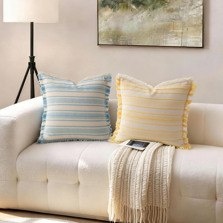 Square cushion cover made of hand-woven cotton blend with decorative fringe trim Kalsten