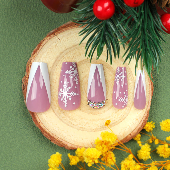 Artistic Nail Extensions with Snowflake Design and Glitter Accents Kalsten
