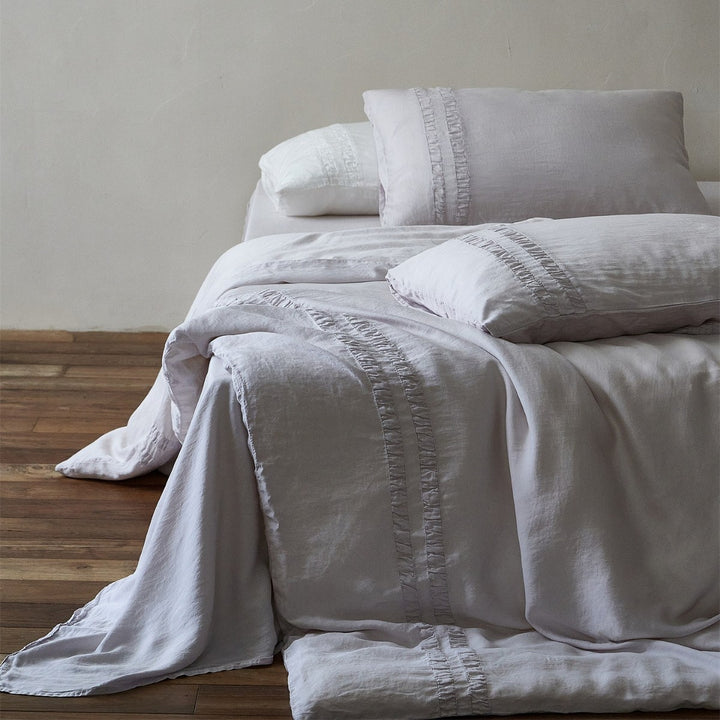 Linen bedding set with stonewash finish and delicate ruffle inserts