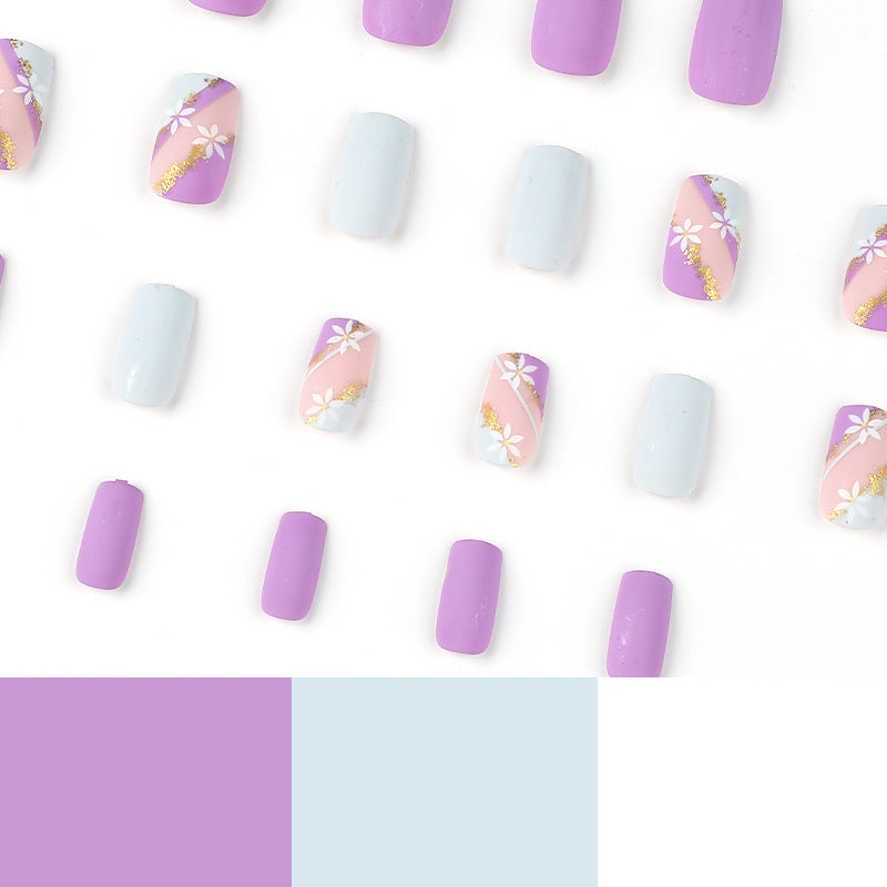 Artistic nail designs with floral motifs and glitter accents Kalsten