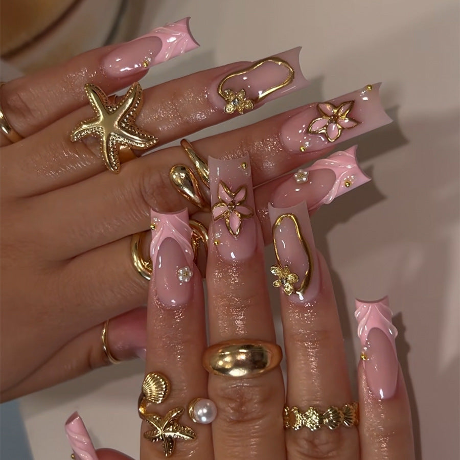 Acrylic nail set with glamorous golden accents Kalsten