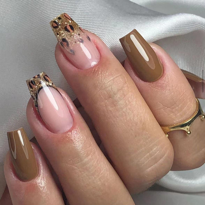 Glamorous acrylic nails with glitter and leopard designs Kalsten