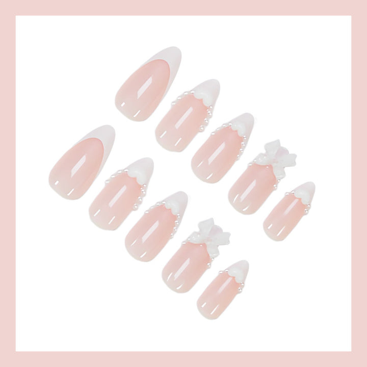Artificial nail set with elegant tips and playful bow details Kalsten