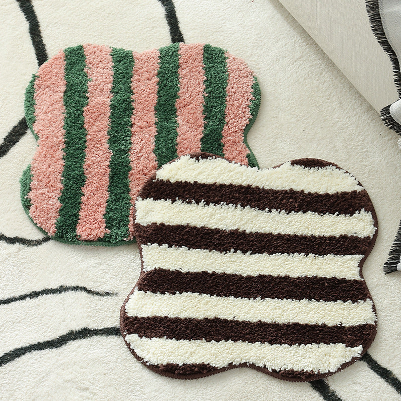 Shaped high pile bath mat with diagonal stripe structure