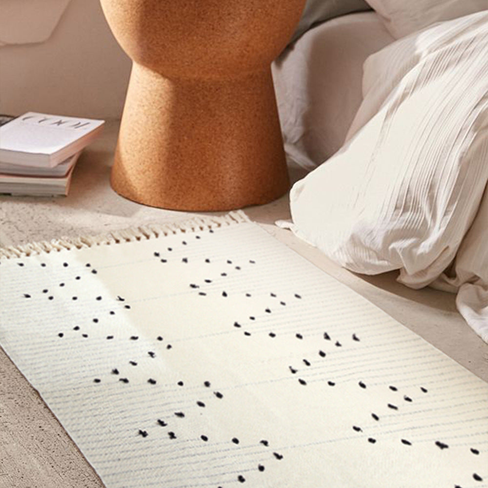 Handwoven cotton rug with dot tuft zigzag and fringed edge