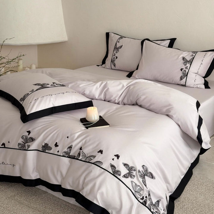Bedding set with butterfly embroidery and contrast piping