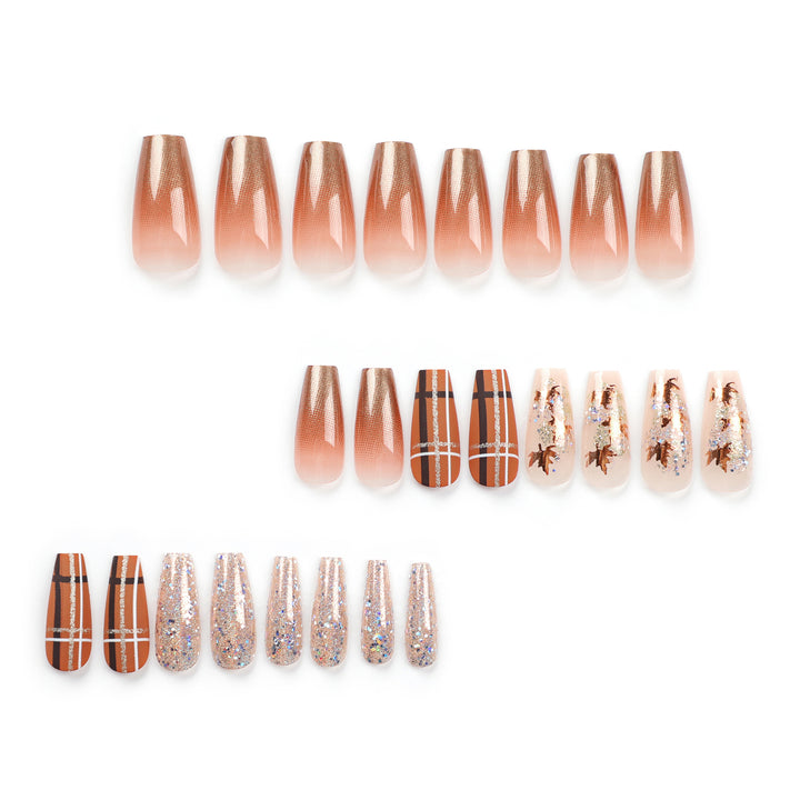 Artful nail extensions with glitter and leaf patterns Kalsten