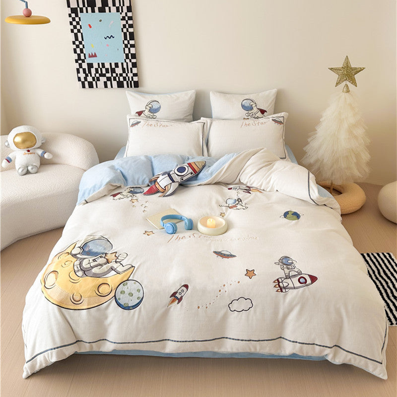Child bedding set made of soft cotton blend with embroidered astronaut and rocket motif