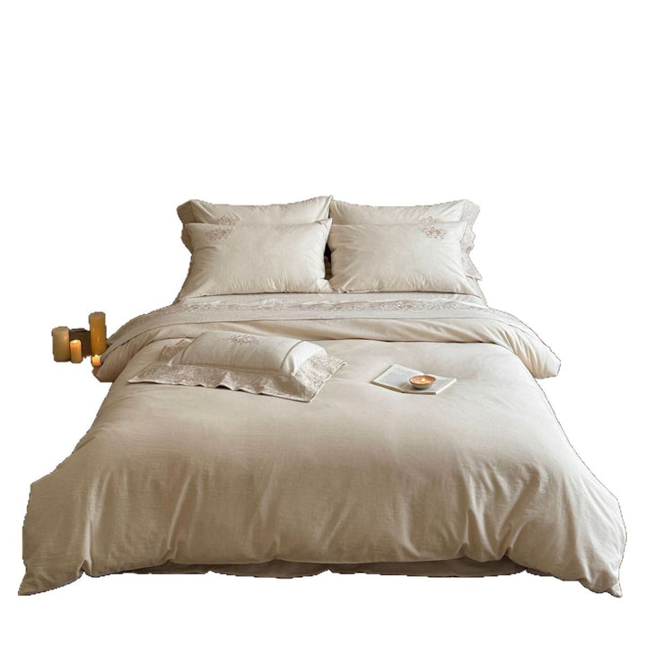Fine linen bed linen set with floral tone-on-tone embroidery and hem detail