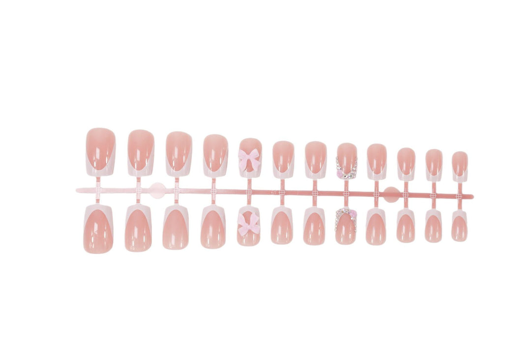 Artificial nail set with elegant bow and glitter designs Kalsten