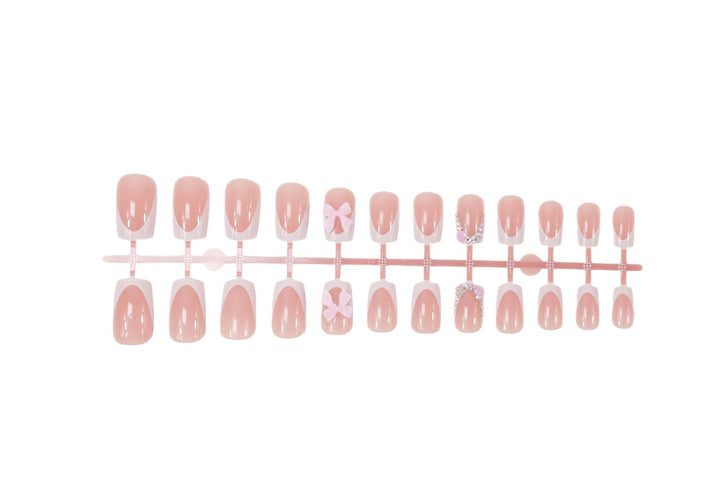 Artificial nail set with elegant bow and glitter designs Kalsten