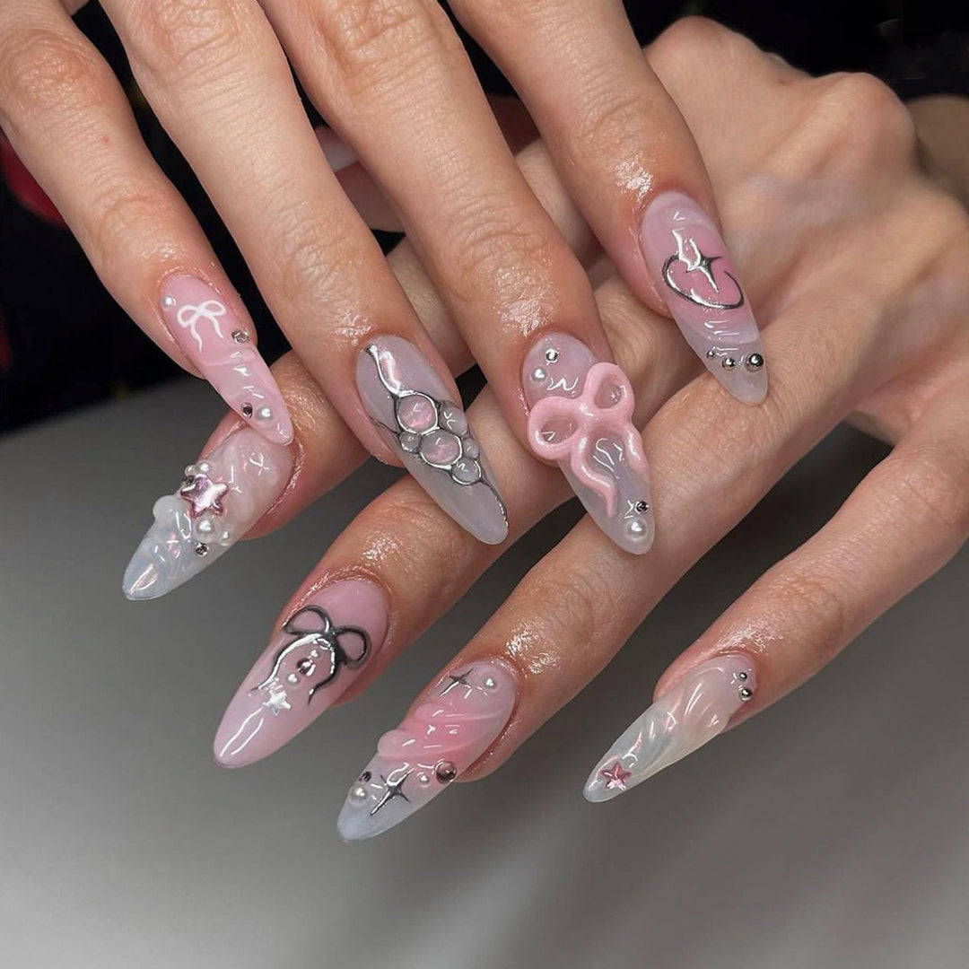 Artful stiletto nails in an elegant design with creative embellishments Kalsten