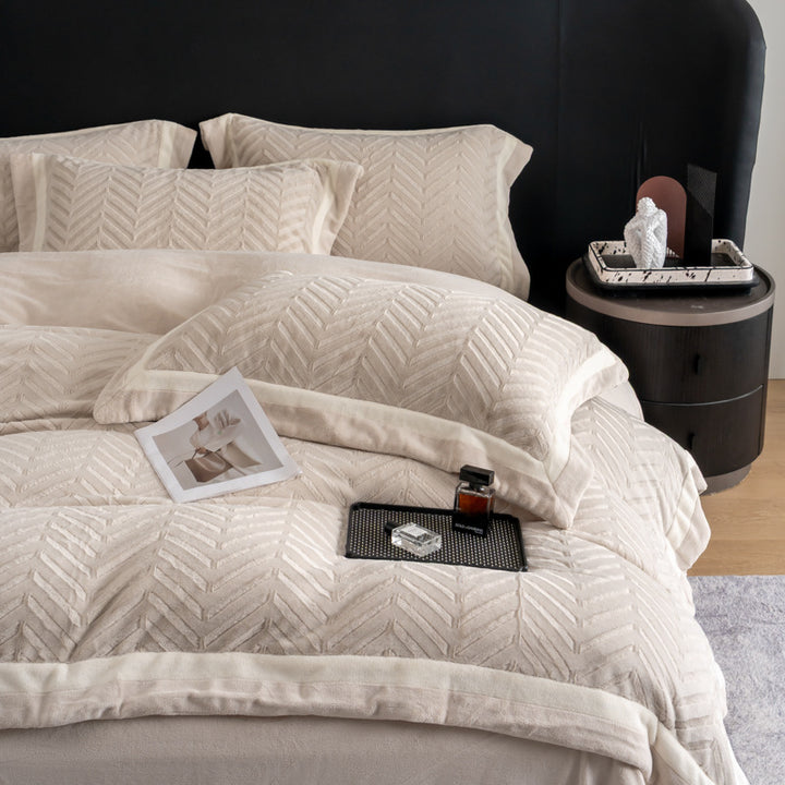 Padded velvet-look bedding set with chevron relief and piping edge