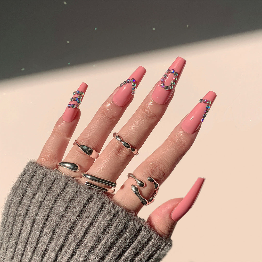Artificial nail extensions with elegant rhinestone embellishments Kalsten
